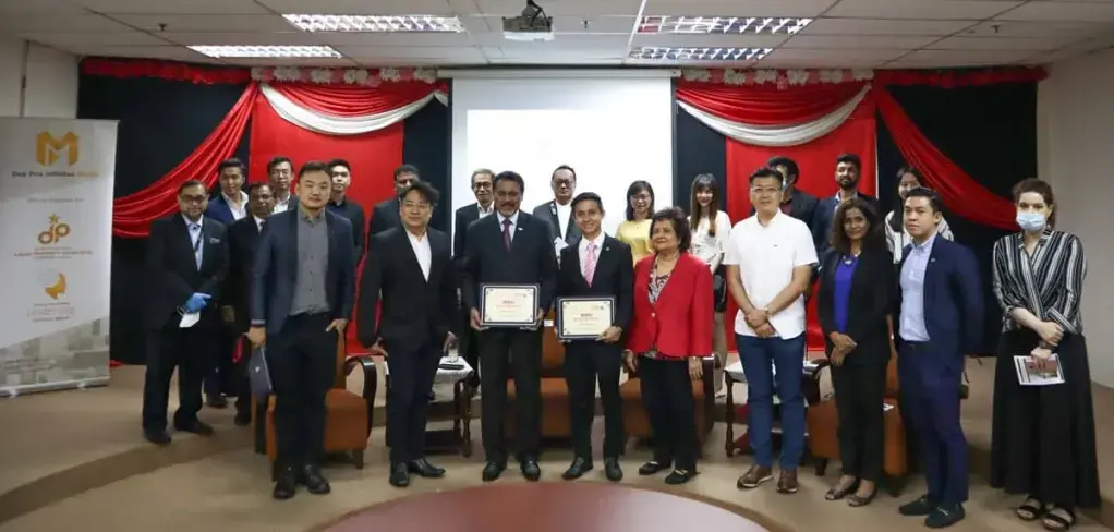 Group photo featuring Dato' Sri David Sew, Tan Sri Dato' Professor Joseph Adaikalam, Mr. Hagenz Choo, and Professor Dr. Sulochana Nair at the MoU signing event