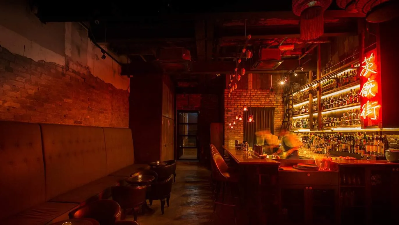 a wide shot of the PS150 bar that showcases antique furnishing and exposed bricks