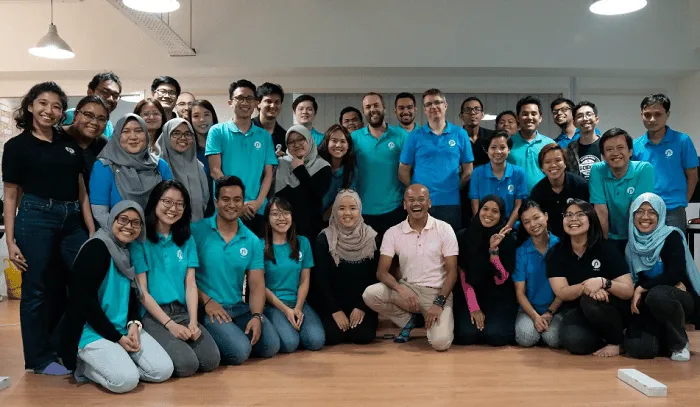 A picture of Azran Osman-Rani with his team at Naluri in their office.