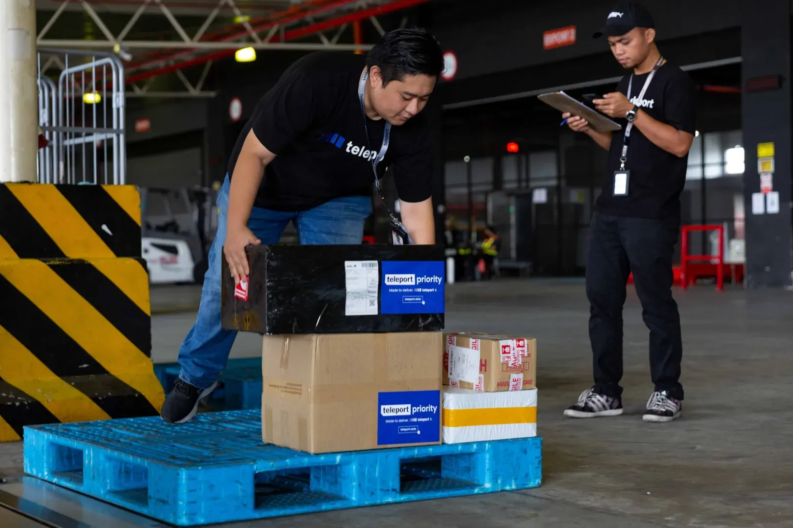 A photo of the logistics team of Teleport preparing goods to send out for delivery.
