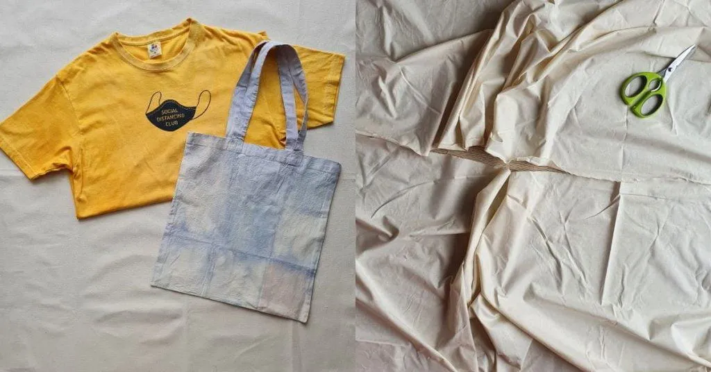 A yellow t shirt and denim tote bag and a sheet of fabric being cut through