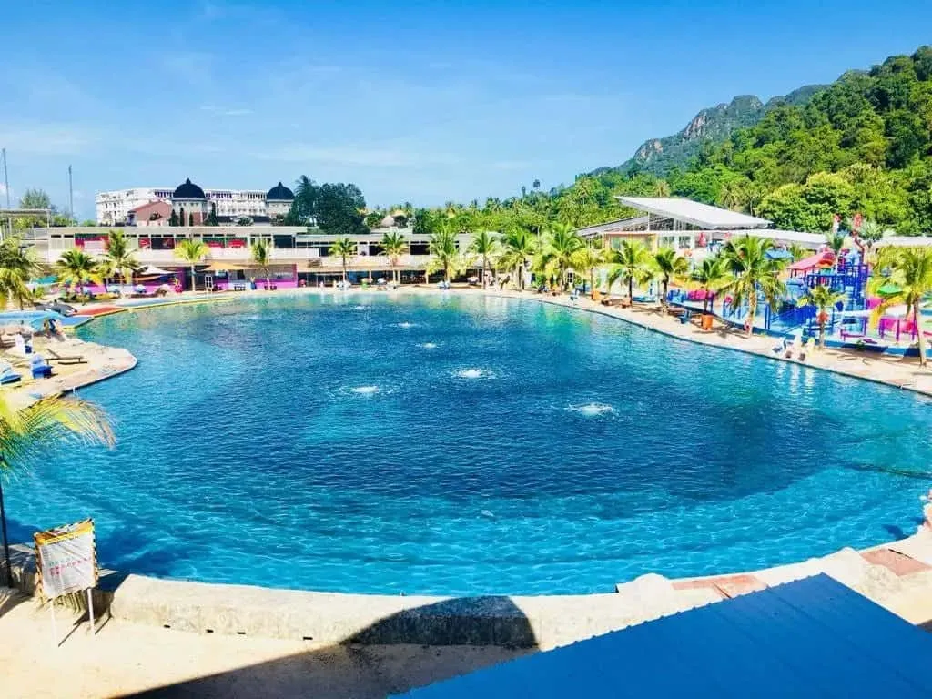 A swimming pool with jacuzzi jets in Perdana Quay Eco Marine Park