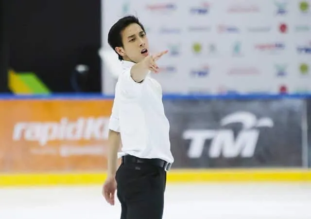 Ice skater julian yee skating at the 2018 winter olympics