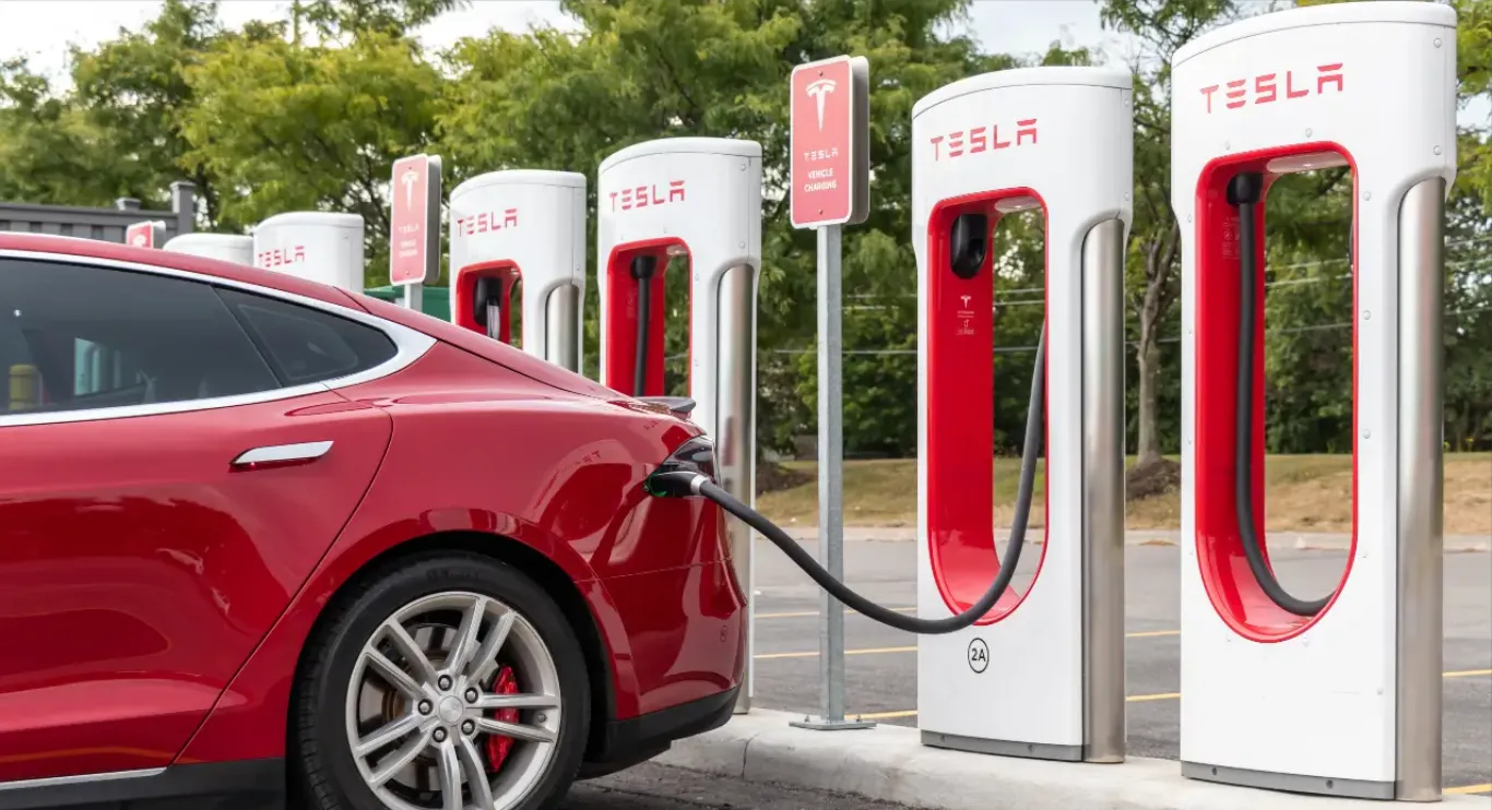 An image of Tesla car charging at Tesla charging station