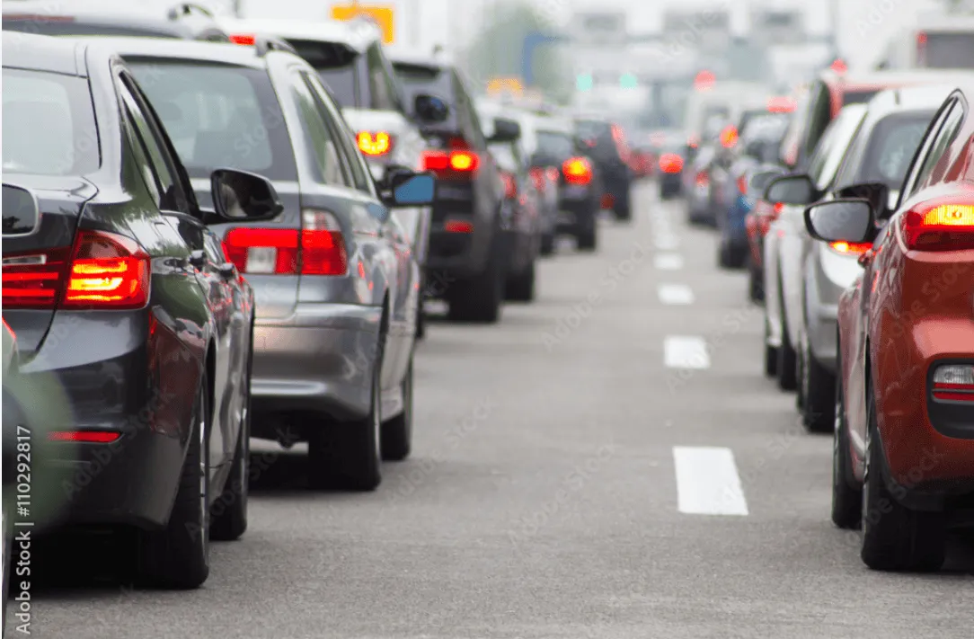 Cars stuck  in a traffic jam.