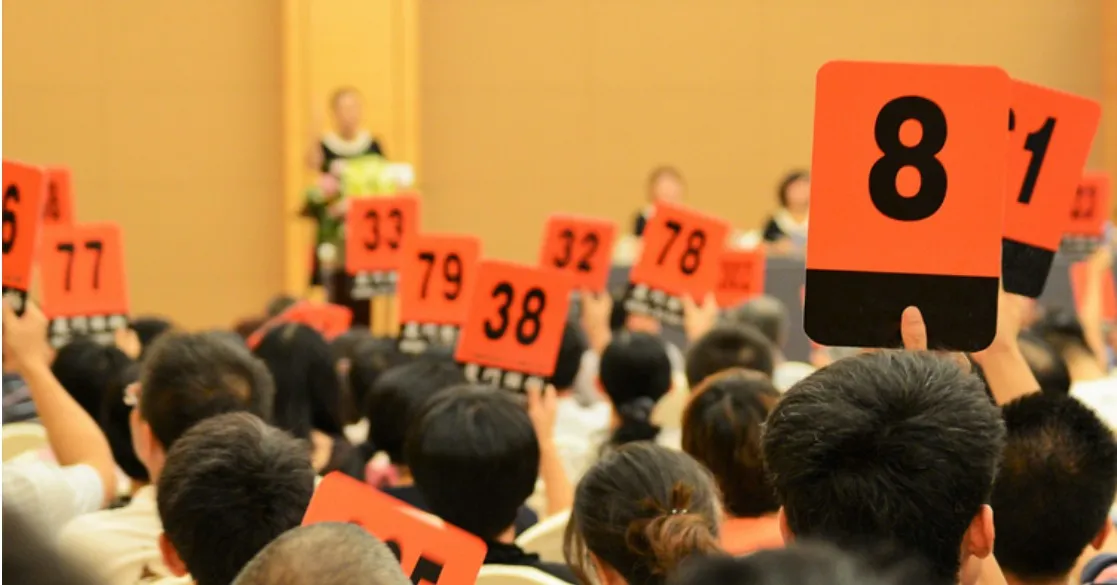 Featuring an image of live property auction