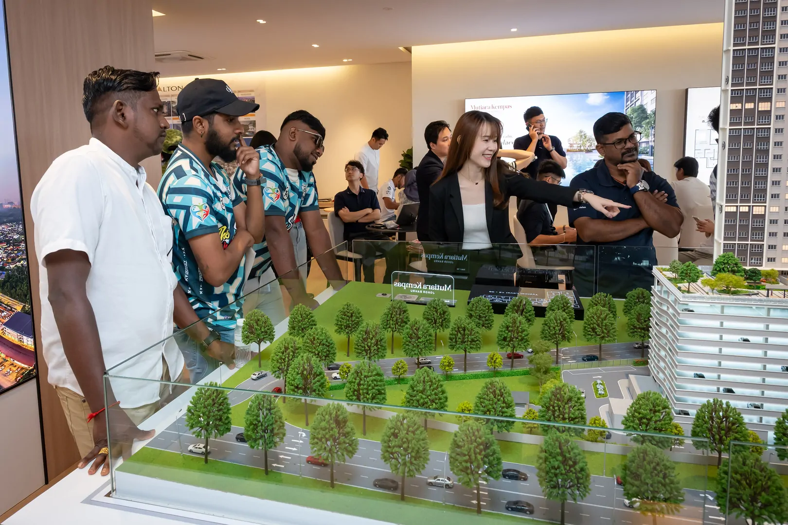 Visitors viewing the unit layouts and scale model.