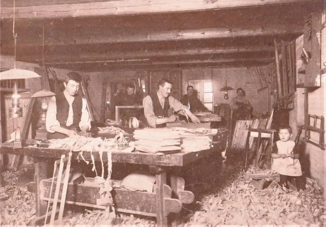Ole Kirk (front left) in his brother’s workshop in Give